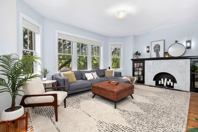 2127 W Pierce Ave Unit 2A, Chicago, IL 60622 - living room featuring plenty of natural light, a fireplace, and wood finished floors