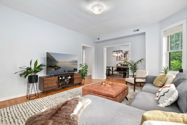 2127 W Pierce Ave Unit 2A, Chicago, IL 60622 - living room featuring a chandelier and wood finished floors