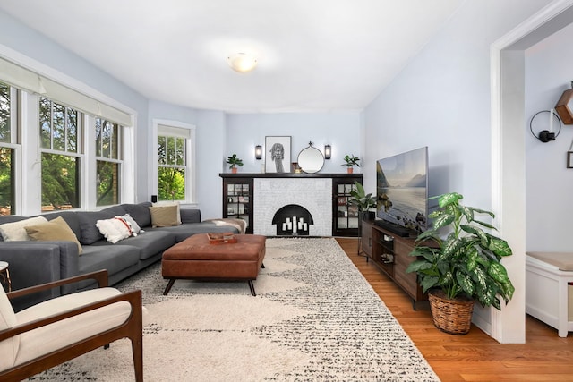2127 W Pierce Ave Unit 2A, Chicago, IL 60622 - living room with wood finished floors and a brick fireplace