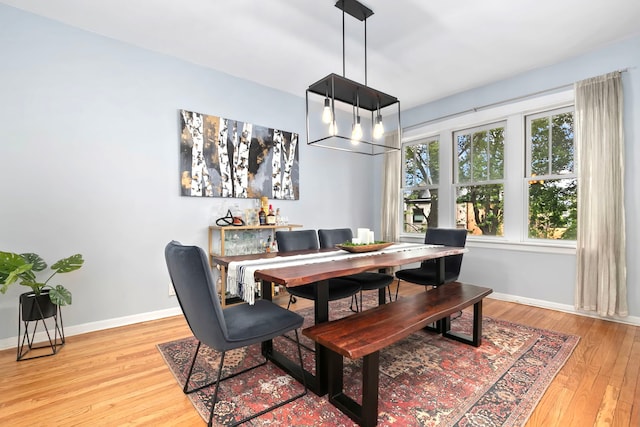 2127 W Pierce Ave Unit 2A, Chicago, IL 60622 - dining room with light wood-style floors and a chandelier