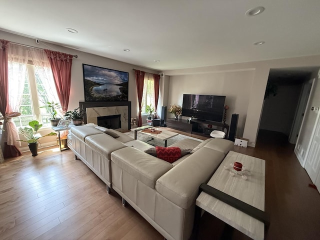 49 Beaconsfield Ct, Lincolnshire, IL 60069 - living room featuring a high end fireplace, wood finished floors, and recessed lighting