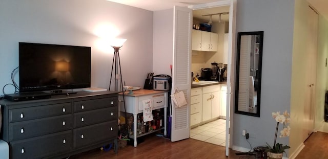 21 W Goethe St Unit 7C, Chicago, IL 60610 - bedroom with wood finished floors, a sink, and connected bathroom