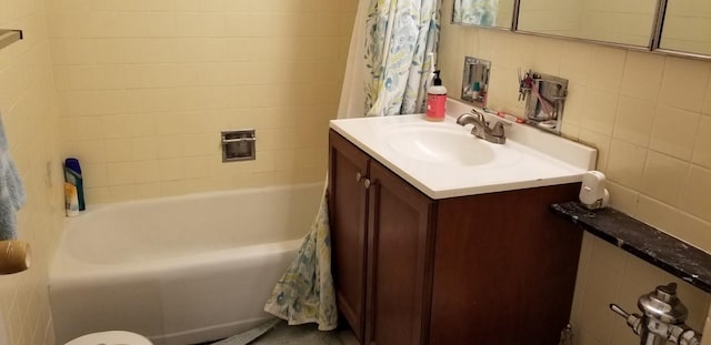 21 W Goethe St Unit 7C, Chicago, IL 60610 - bathroom with vanity, shower / bath combination with curtain, and tile walls