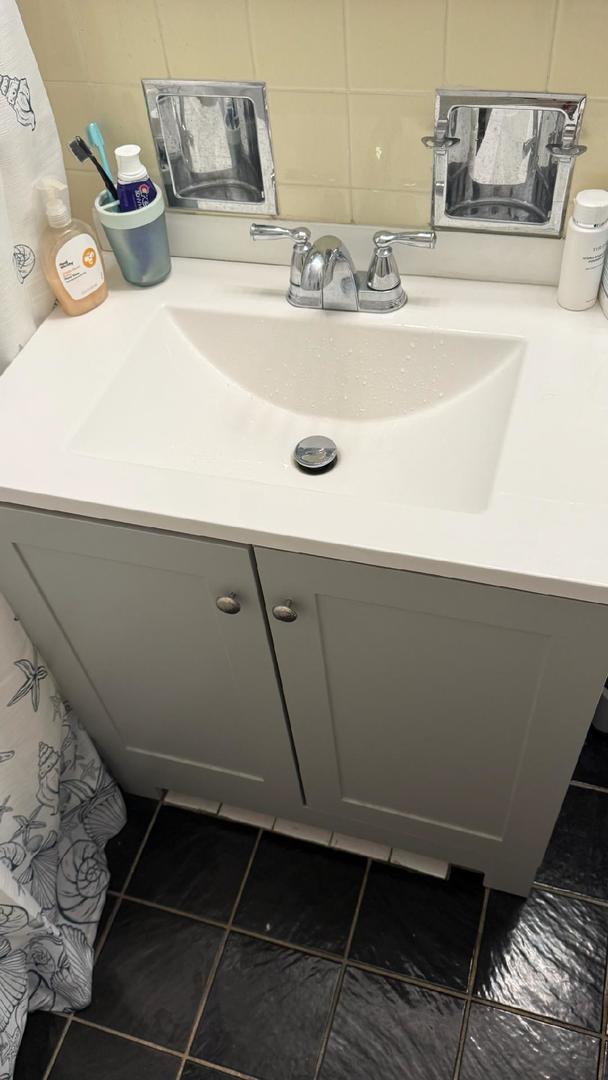 21 W Goethe St Unit 7C, Chicago, IL 60610 - bathroom featuring tile patterned floors and vanity