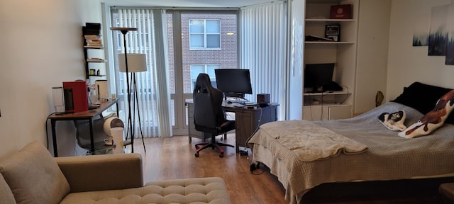 21 W Goethe St Unit 7C, Chicago, IL 60610 - bedroom featuring wood finished floors and an office area