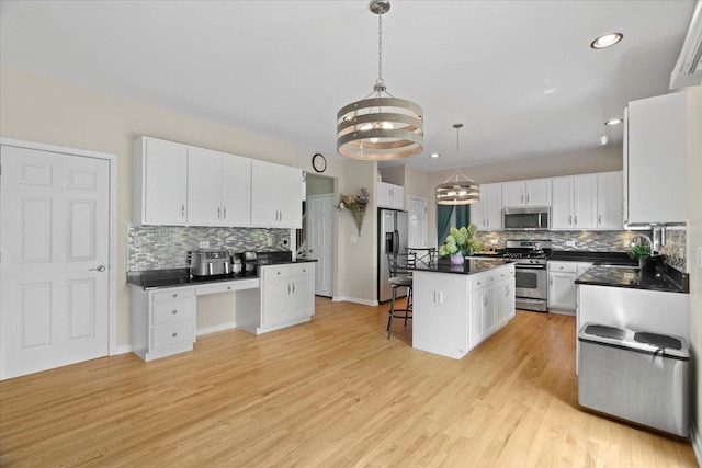 13613 Arborview Blvd, Plainfield, IL 60585 - kitchen with stainless steel appliances, a chandelier, decorative backsplash, white cabinetry, and recessed lighting