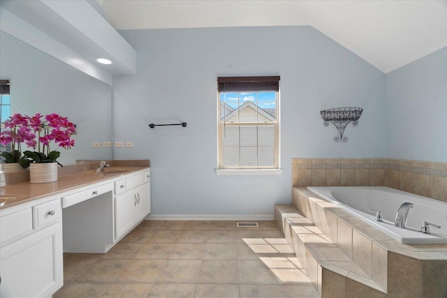 13613 Arborview Blvd, Plainfield, IL 60585 - bathroom featuring a bath, vanity, and vaulted ceiling