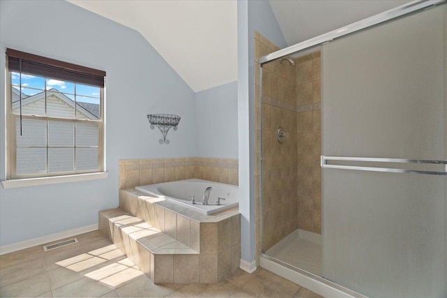 13613 Arborview Blvd, Plainfield, IL 60585 - bathroom featuring vaulted ceiling, a garden tub, a stall shower, and tile patterned floors