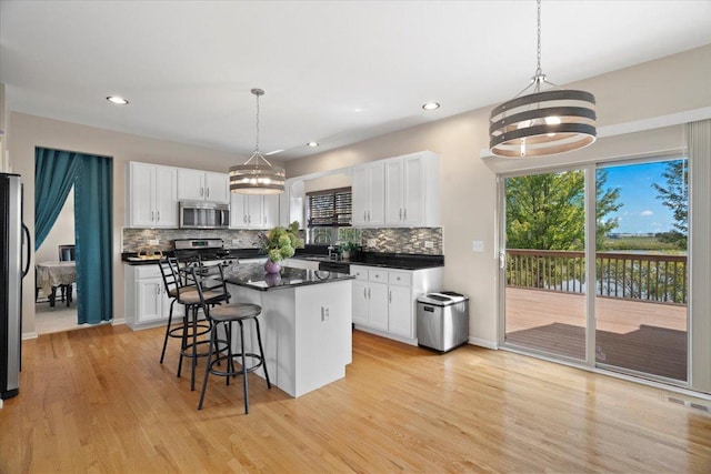 13613 Arborview Blvd, Plainfield, IL 60585 - kitchen featuring appliances with stainless steel finishes, tasteful backsplash, white cabinetry, and recessed lighting