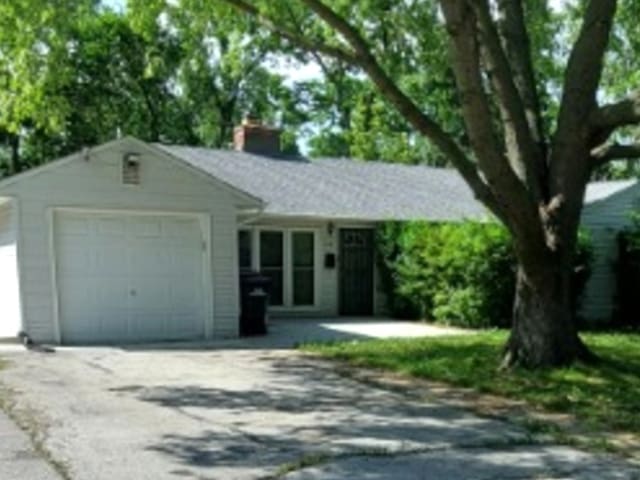348 Niagara St, Park Forest, IL 60466 - ranch-style home with concrete driveway, a garage, and a chimney