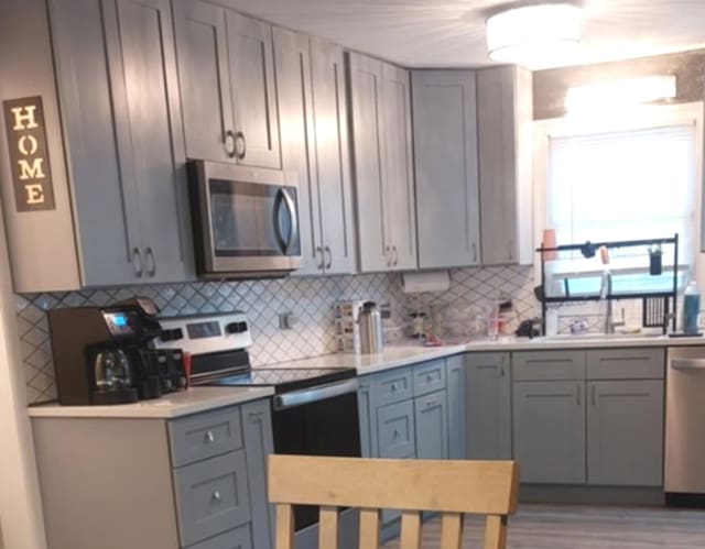348 Niagara St, Park Forest, IL 60466 - kitchen with stainless steel appliances and gray cabinets