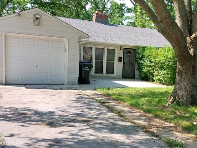 348 Niagara St, Park Forest, IL 60466 - ranch-style house featuring a chimney, roof with shingles, an attached garage, and concrete driveway
