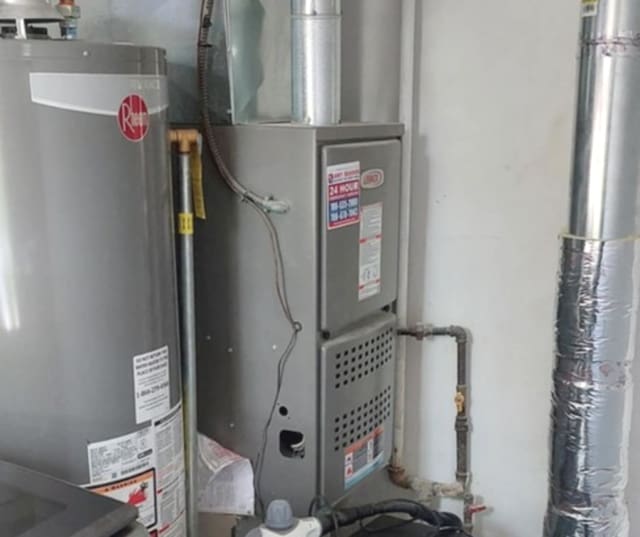 348 Niagara St, Park Forest, IL 60466 - utility room featuring gas water heater and heating unit