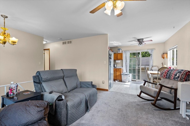334 Idlewood Dr, Bolingbrook, IL 60440 - living room featuring a ceiling fan, a chandelier, light carpet, and baseboards