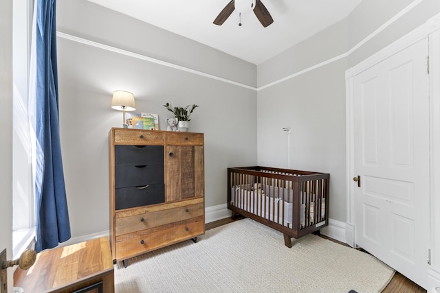 1128 W Wolfram St Unit 2, Chicago, IL 60657 - bedroom featuring a crib and ceiling fan