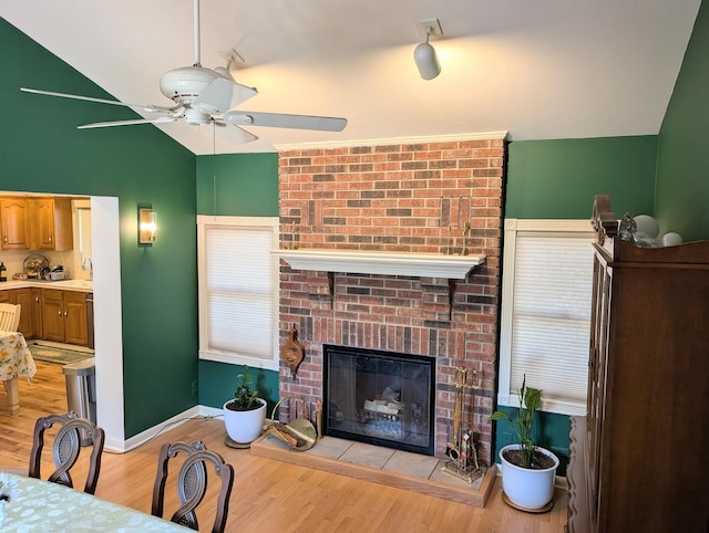 301 N Redfield Ct, Park Ridge, IL 60068 - living area featuring a ceiling fan, a fireplace, lofted ceiling, and light wood-style floors