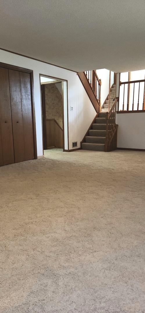 18068 Jason Ln, Lansing, IL 60438 - below grade area featuring carpet flooring and stairs