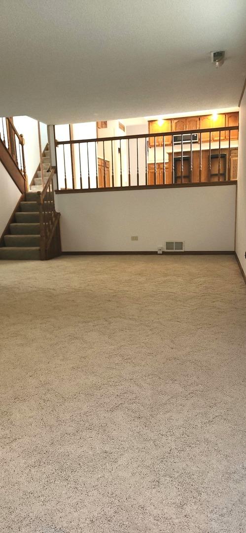 18068 Jason Ln, Lansing, IL 60438 - spare room featuring stairway