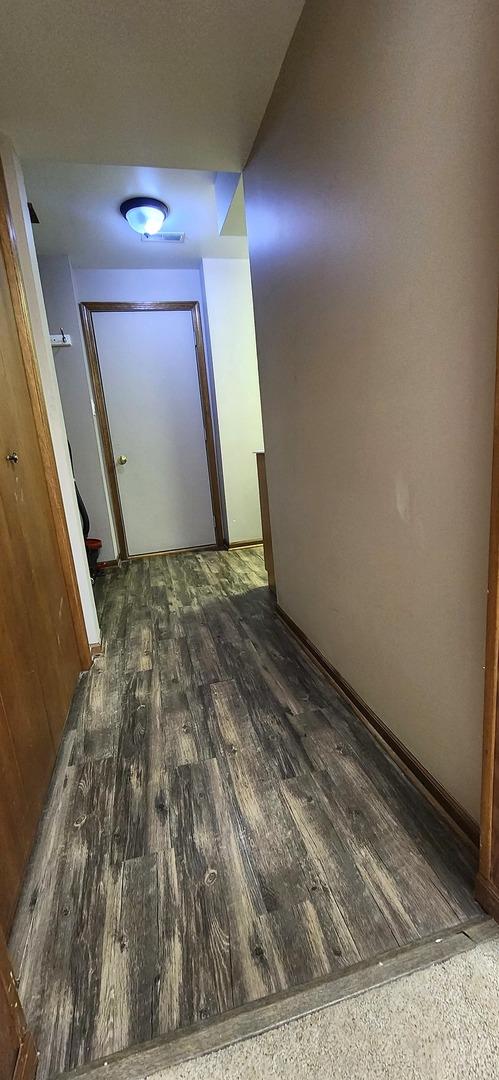 18068 Jason Ln, Lansing, IL 60438 - corridor featuring wood finished floors and baseboards