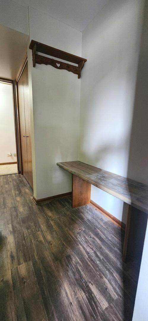 18068 Jason Ln, Lansing, IL 60438 - mudroom featuring dark wood-style floors and baseboards