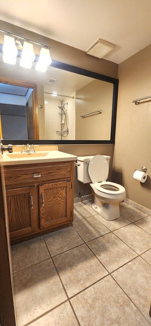18068 Jason Ln, Lansing, IL 60438 - bathroom featuring tile patterned flooring and vanity