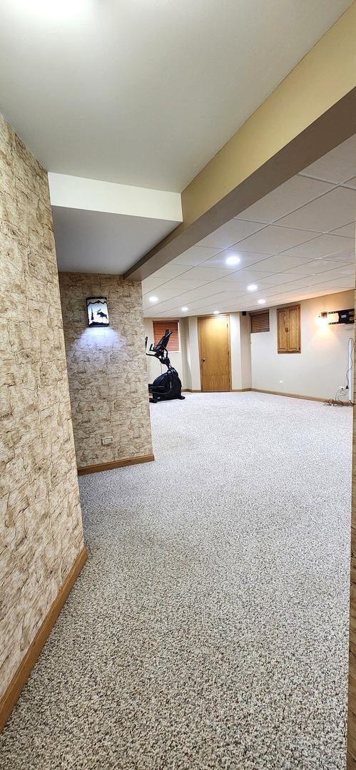 18068 Jason Ln, Lansing, IL 60438 - finished below grade area featuring baseboards and carpet flooring