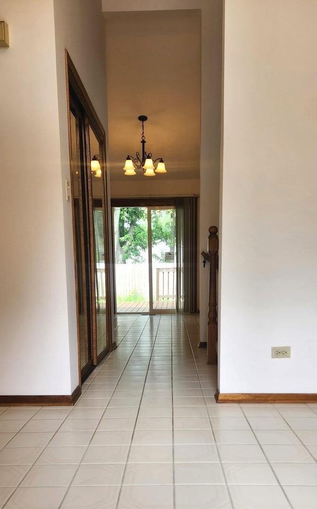 18068 Jason Ln, Lansing, IL 60438 - hallway featuring a chandelier and light tile patterned floors