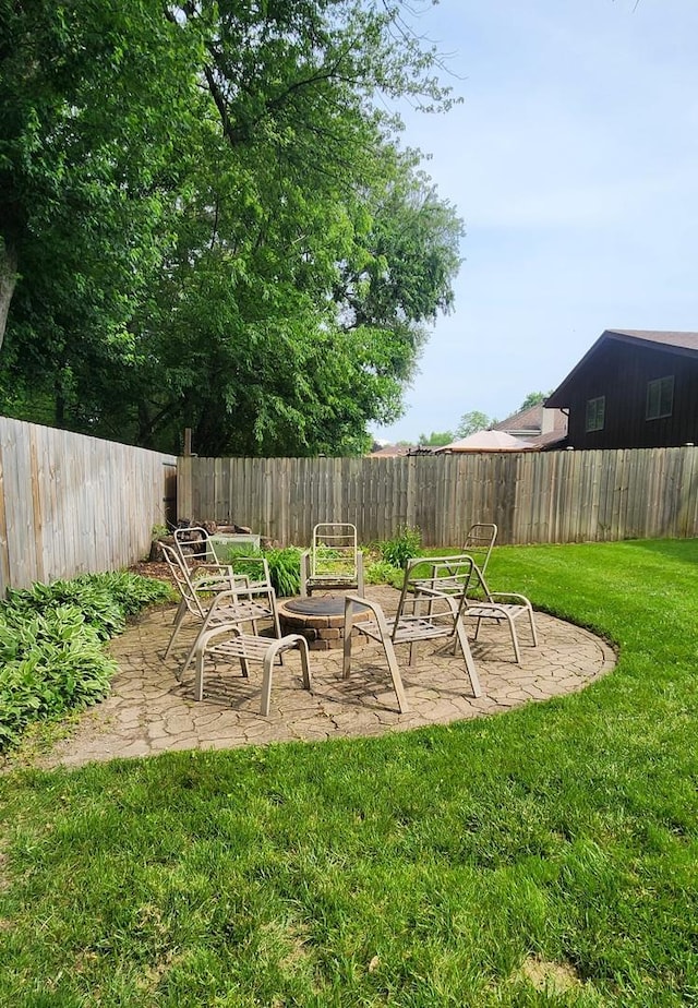 18068 Jason Ln, Lansing, IL 60438 - fenced backyard featuring a fire pit and a patio