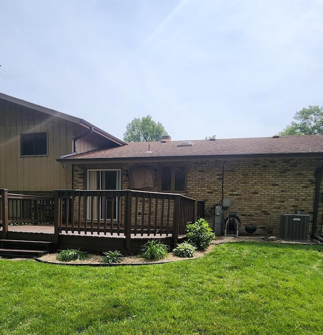 18068 Jason Ln, Lansing, IL 60438 - back of property featuring a wooden deck, brick siding, and a lawn