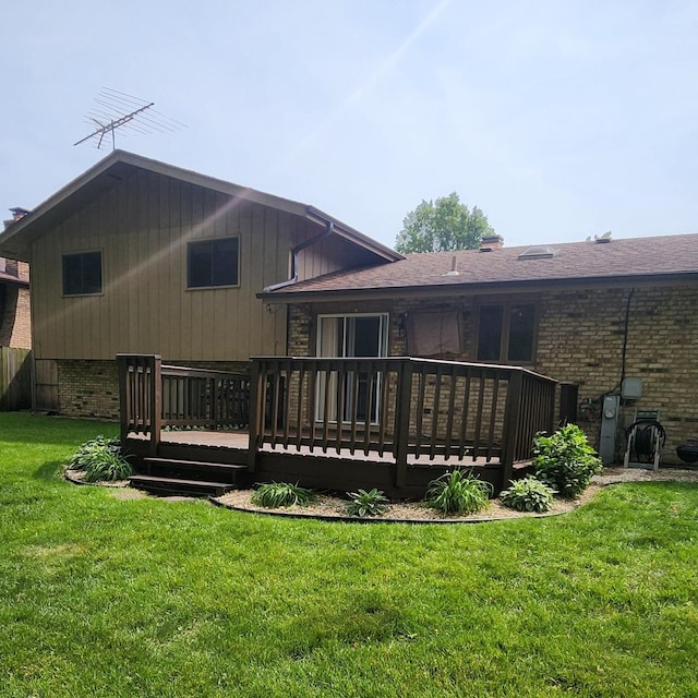 18068 Jason Ln, Lansing, IL 60438 - back of property featuring brick siding, a deck, and a yard