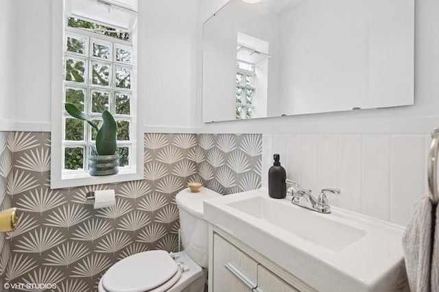 5016 Suffield Ct Unit A, Skokie, IL 60077 - half bath with vanity, a wainscoted wall, and plenty of natural light