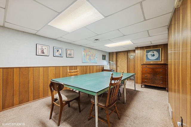 1613 Douglas St, Joliet, IL 60435 - dining area with wood walls, carpet flooring, and a paneled ceiling