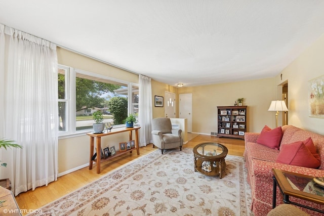 1613 Douglas St, Joliet, IL 60435 - living room featuring wood finished floors and baseboards
