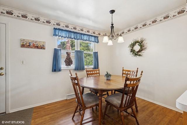 1613 Douglas St, Joliet, IL 60435 - dining area featuring wood finished floors and a chandelier