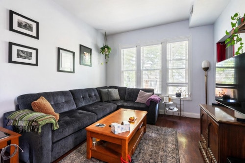 3137 N Monticello Ave, Chicago, IL 60618 - living area with dark wood-style floors and baseboards