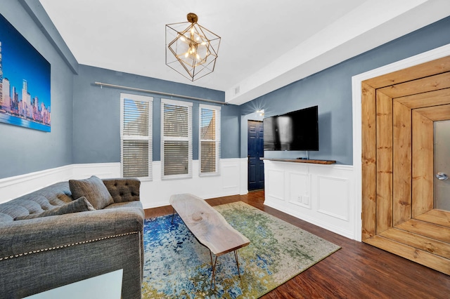 3137 N Monticello Ave, Chicago, IL 60618 - living area featuring a chandelier, wood finished floors, and wainscoting