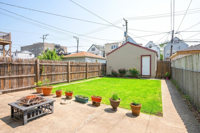 3137 N Monticello Ave, Chicago, IL 60618 - view of yard featuring a fire pit, a patio, and an outdoor structure