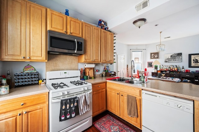 3137 N Monticello Ave, Chicago, IL 60618 - kitchen featuring white appliances, a sink, a peninsula, backsplash, and light countertops