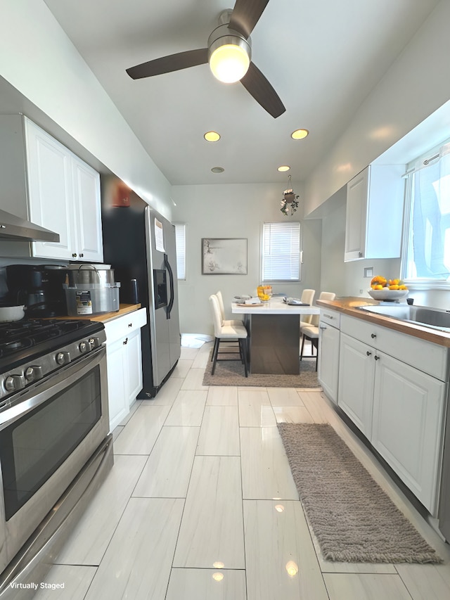 3231 N Schultz Dr, Lansing, IL 60438 - kitchen featuring appliances with stainless steel finishes, white cabinetry, healthy amount of natural light, and recessed lighting