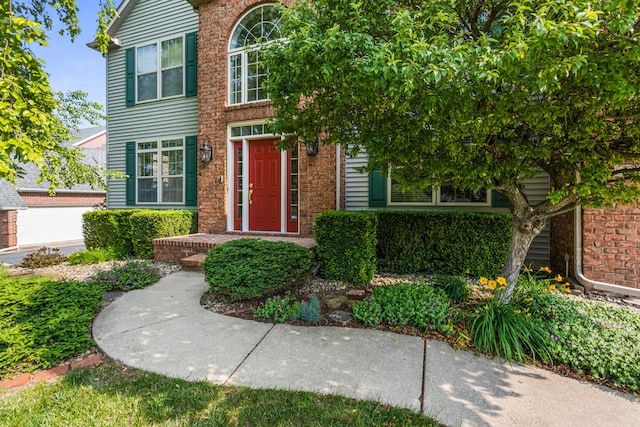 3208 Countrybend Ln, Champaign, IL 61822 - entrance to property featuring brick siding and a garage