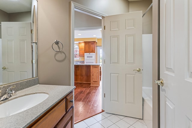 3208 Countrybend Ln, Champaign, IL 61822 - full bath featuring vanity, tile patterned floors, and a bathtub