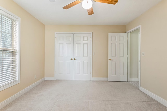 3208 Countrybend Ln, Champaign, IL 61822 - unfurnished bedroom with light colored carpet, a closet, and a ceiling fan
