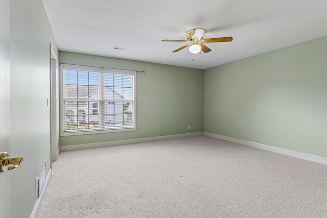 3208 Countrybend Ln, Champaign, IL 61822 - carpeted empty room featuring a ceiling fan and baseboards