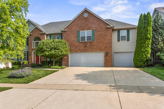 3208 Countrybend Ln, Champaign, IL 61822 - traditional home with brick siding, a garage, and concrete driveway