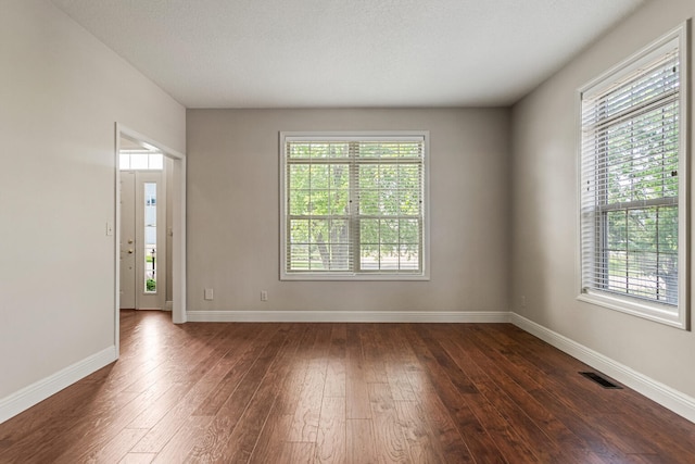 3208 Countrybend Ln, Champaign, IL 61822 - unfurnished room featuring dark wood-style floors and baseboards