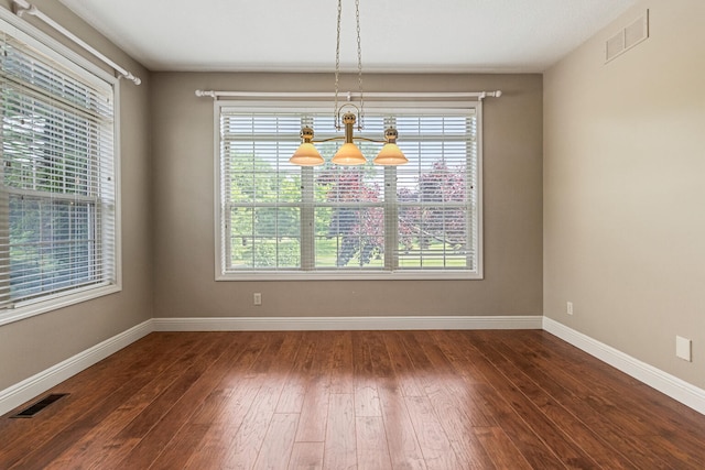 3208 Countrybend Ln, Champaign, IL 61822 - unfurnished dining area featuring healthy amount of natural light and dark wood-style flooring