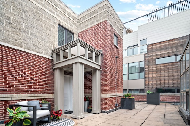 2757 N Wayne Ave Unit E, Chicago, IL 60614 - property entrance featuring brick siding and a patio