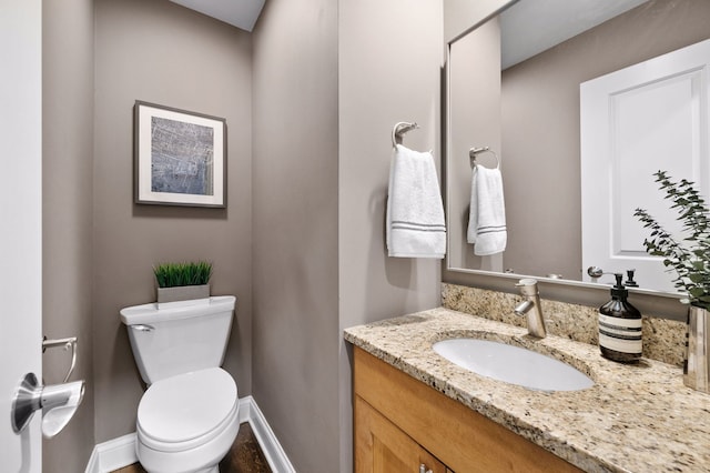 2757 N Wayne Ave Unit E, Chicago, IL 60614 - half bathroom with vanity, toilet, and baseboards