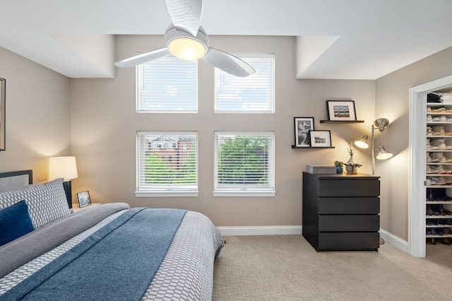 2757 N Wayne Ave Unit E, Chicago, IL 60614 - bedroom featuring multiple windows, light carpet, baseboards, and a ceiling fan