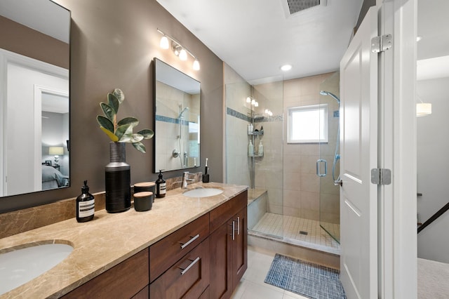 2757 N Wayne Ave Unit E, Chicago, IL 60614 - bathroom featuring ensuite bath, double vanity, a stall shower, and tile patterned floors